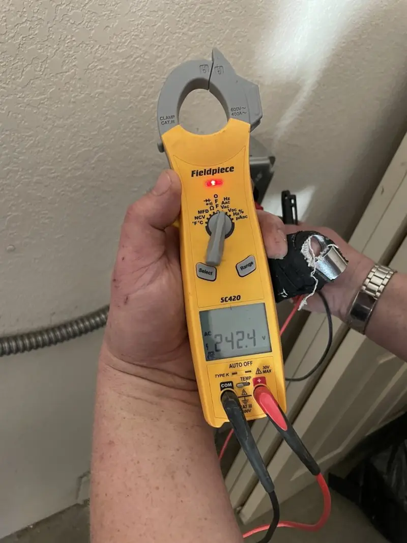 Voltage testing with clamp meter during Electrical Installation Services in Lebanon